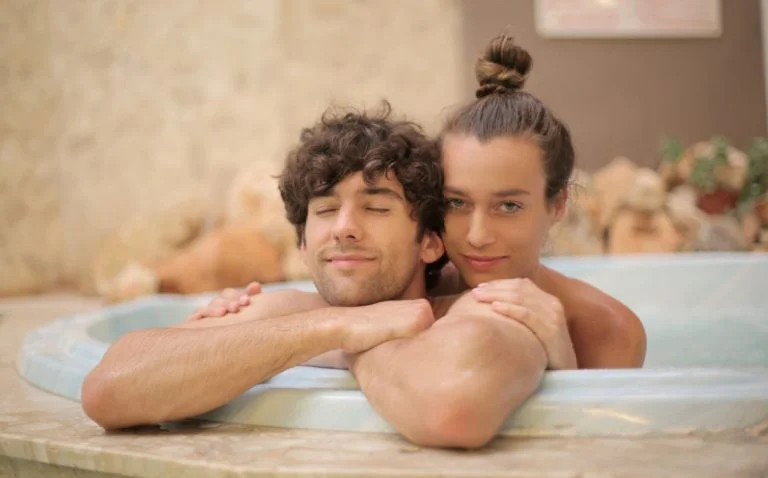 A young couple in a spa bath for a marketing campign for Lala Shambala